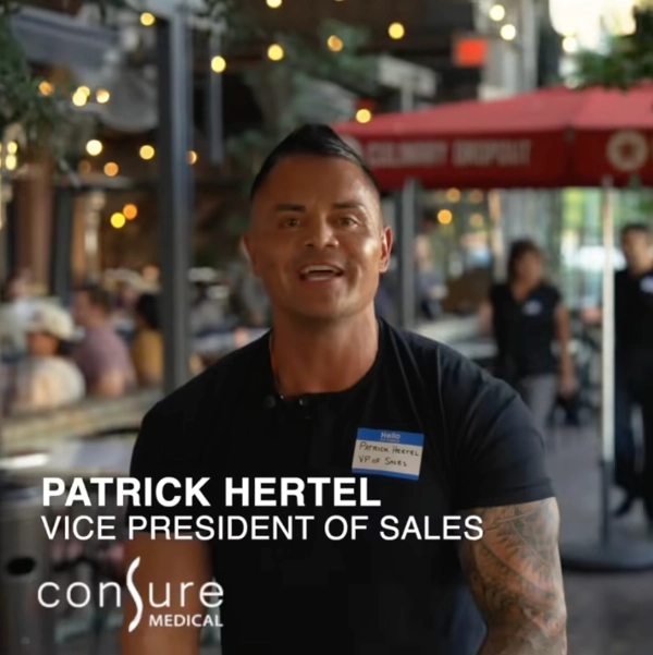 Frame from the Consure Medical QoraMatic ad featuring Patrick Hertel, VP of Sales